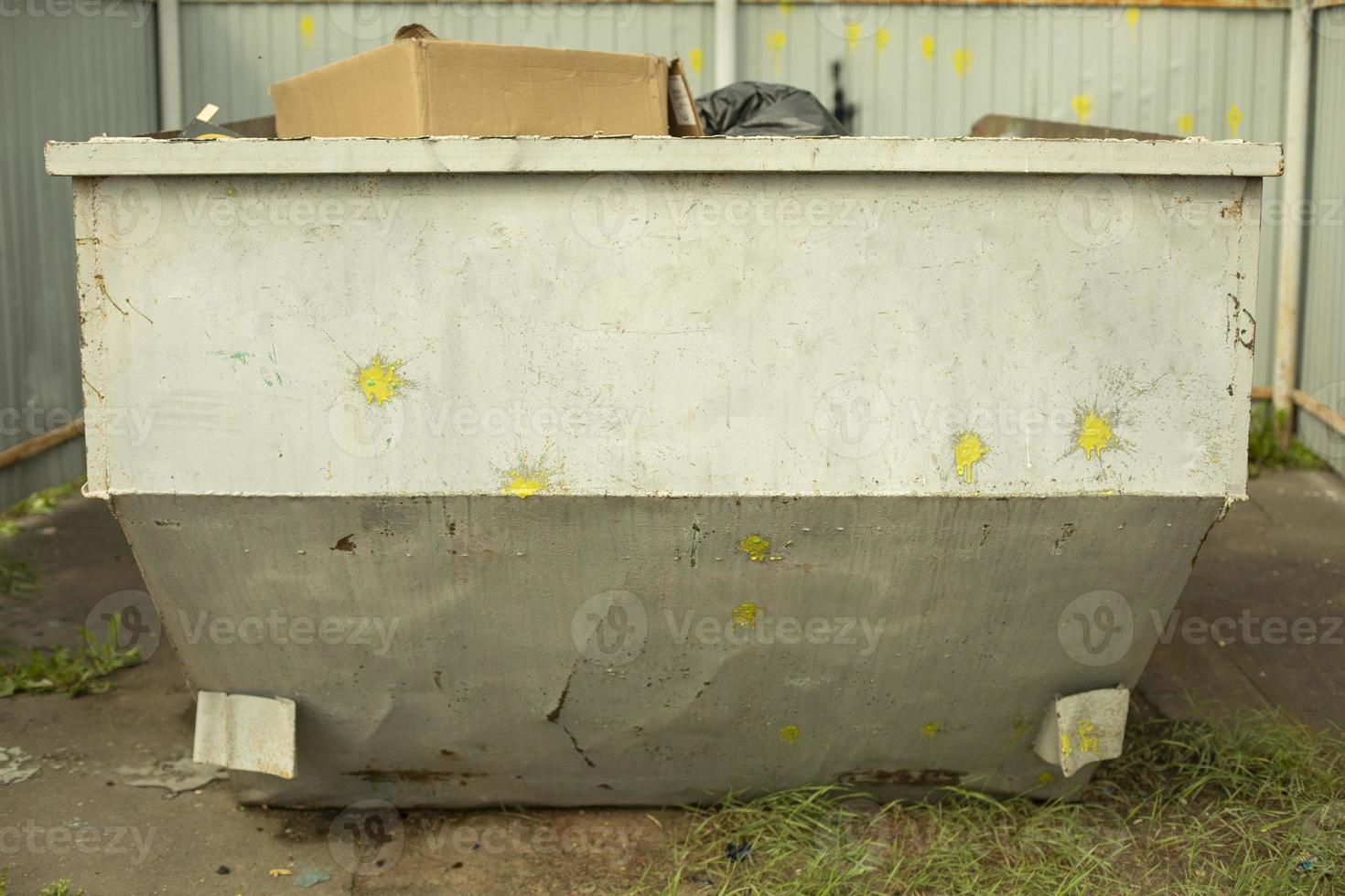 Garbage can for waste. Gray garbage container. photo