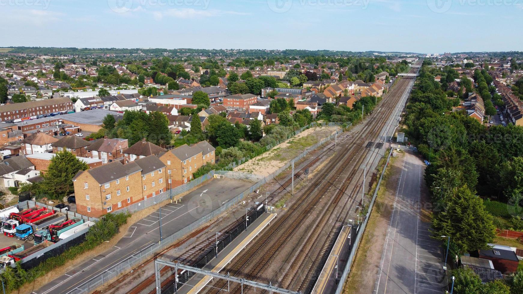 Aerial view of Luton Town with High Angle Footage of Train and Track Passing through city of England UK photo