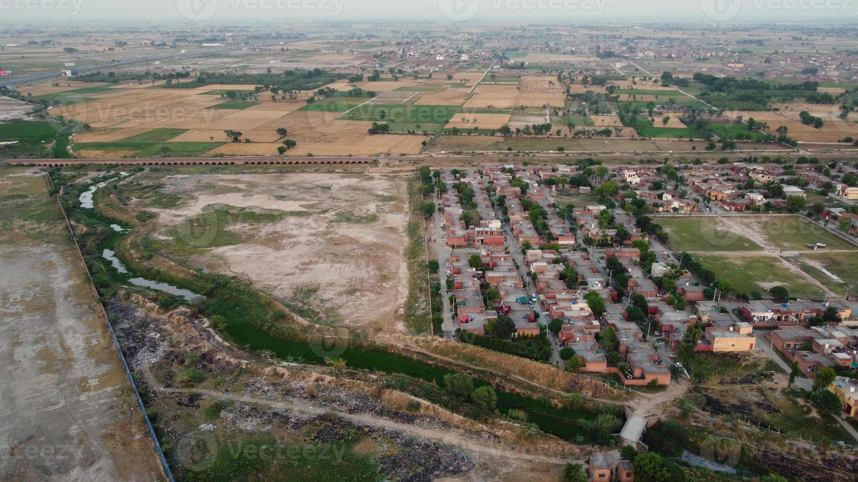 High Angle Footage and Aerial View of Pakistani Motorways M2 at Kala Shah Kaku Interchange to GT road Lahore, The Industrial Village of Punjab photo