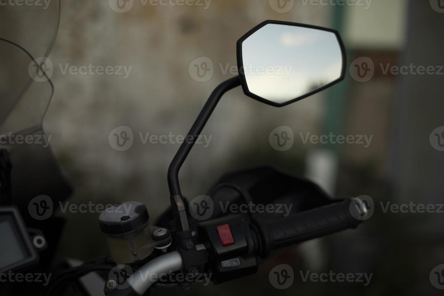 Rear-view mirror on motorcycle. Mirror on bike. photo