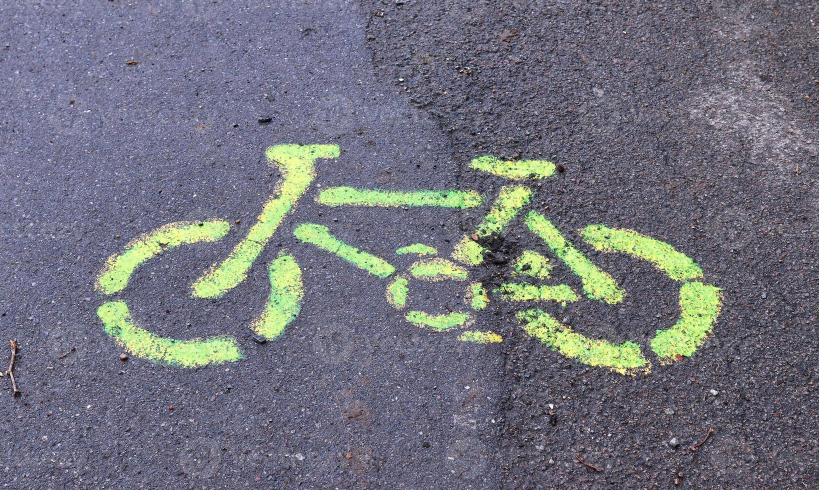 Painted bicycle signs on asphalt found in the city streets of Germany. photo