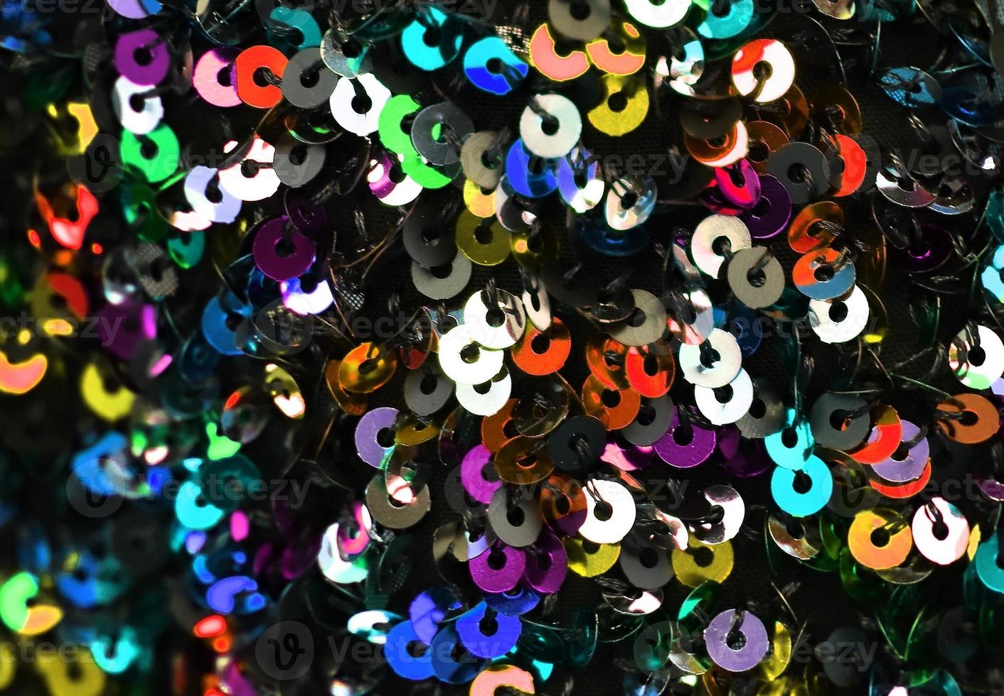 Detailed close up view on samples of cloth and fabrics in different colors found at a fabrics market photo