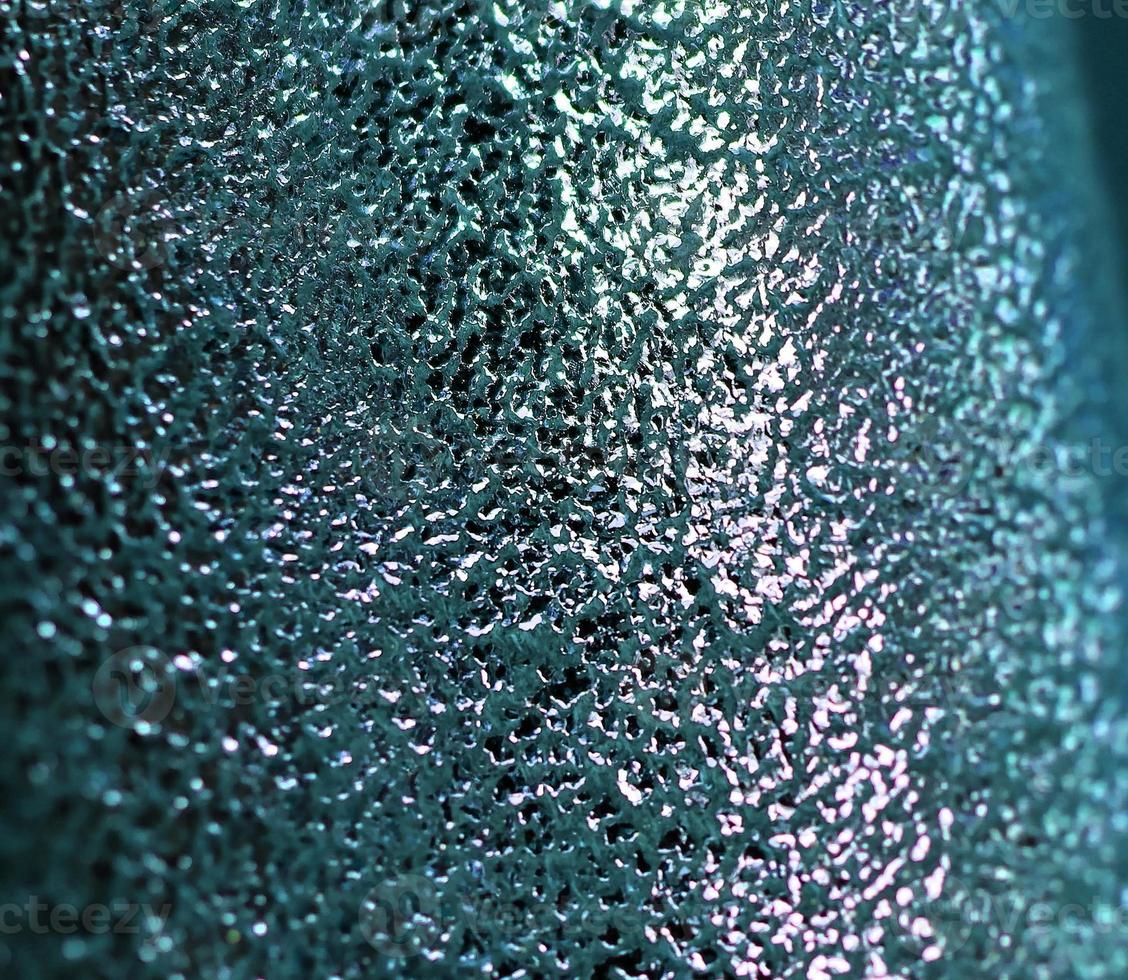 Detailed close up view on samples of cloth and fabrics in different colors found at a fabrics market photo