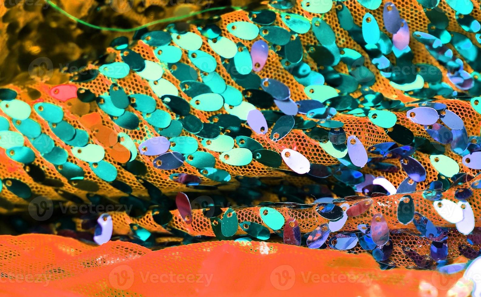 Detailed close up view on samples of cloth and fabrics in different colors found at a fabrics market photo
