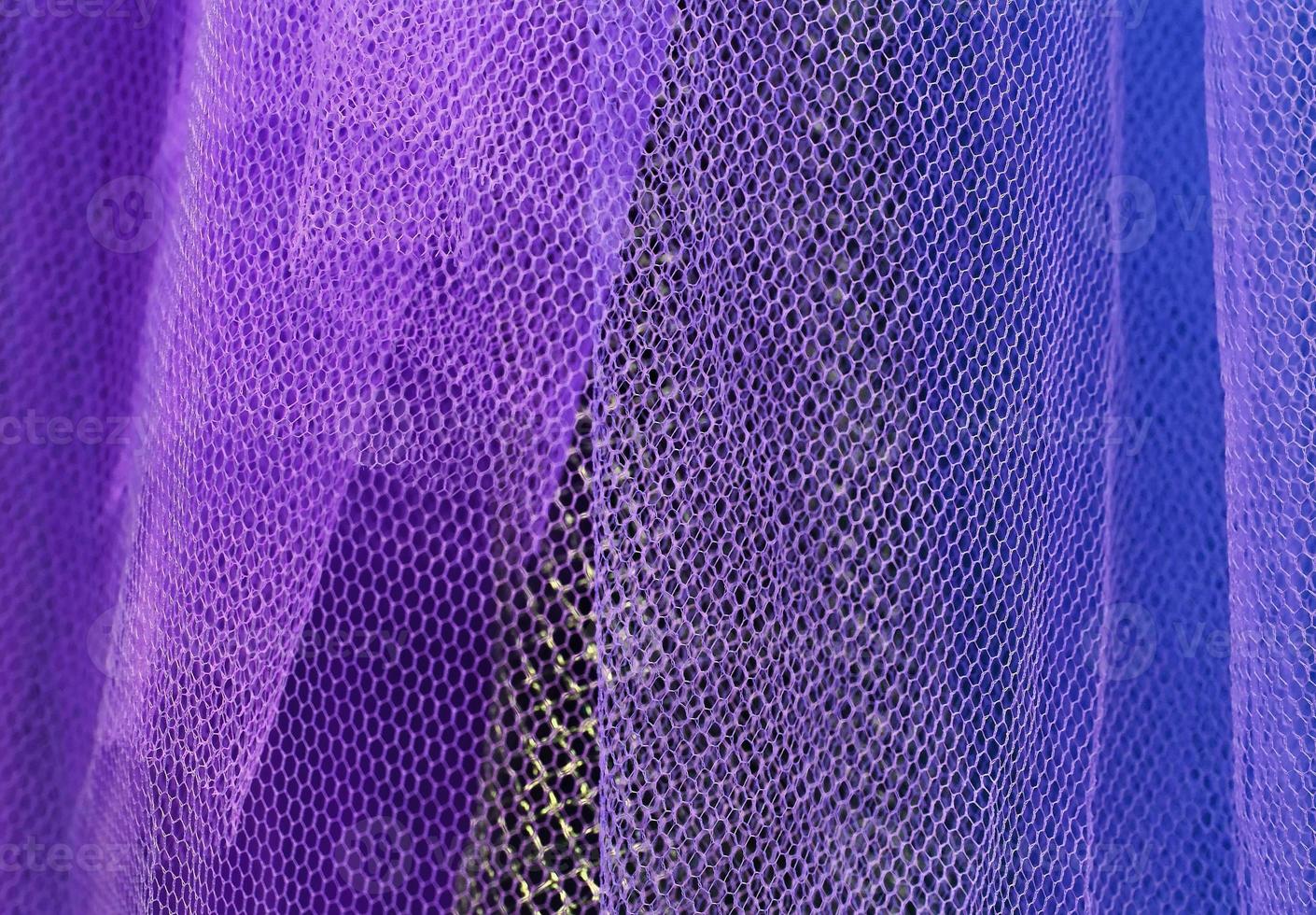 Detailed close up view on samples of cloth and fabrics in different colors found at a fabrics market photo