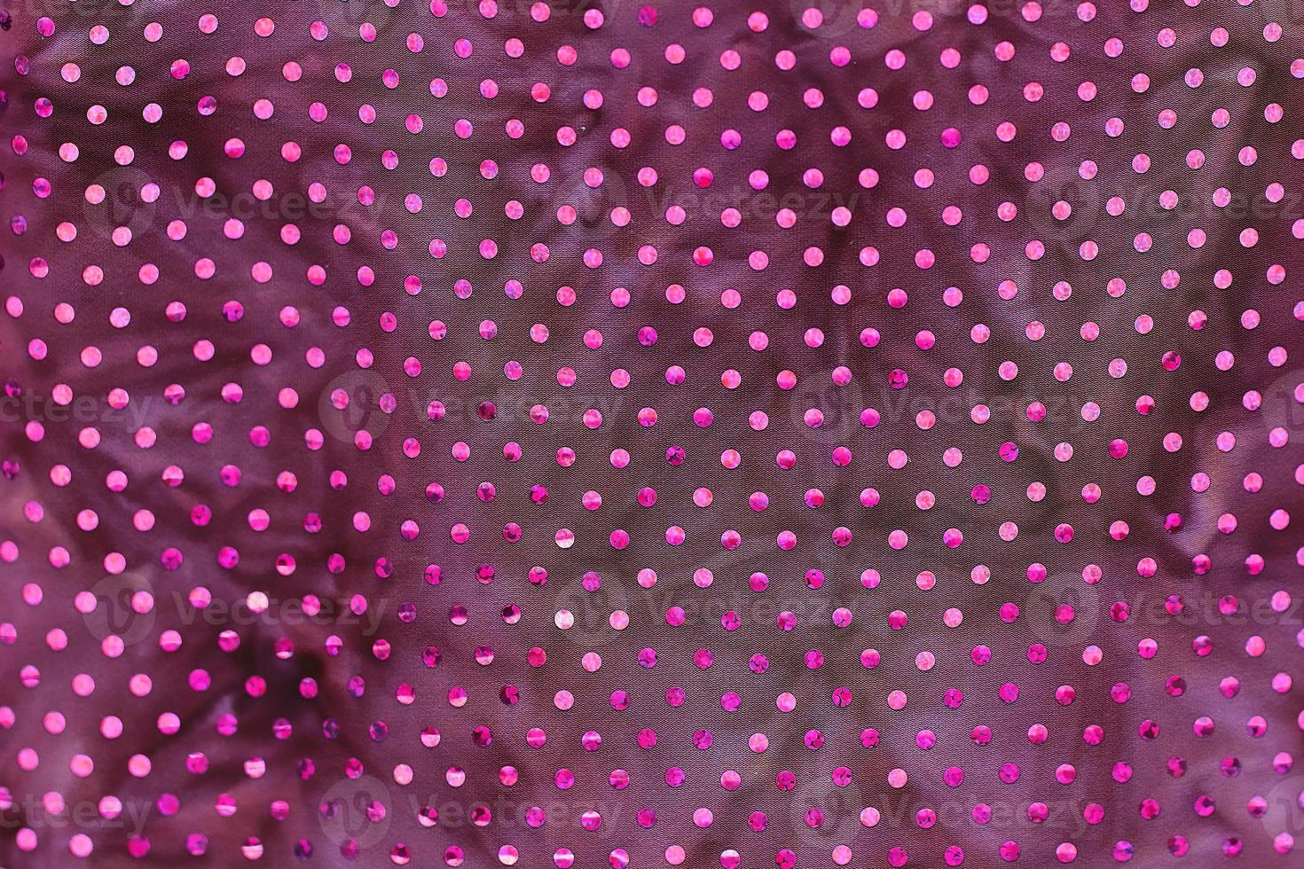 Detailed close up view on samples of cloth and fabrics in different colors found at a fabrics market photo