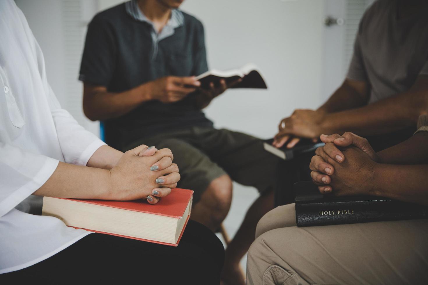 Group of people praying worship believe photo