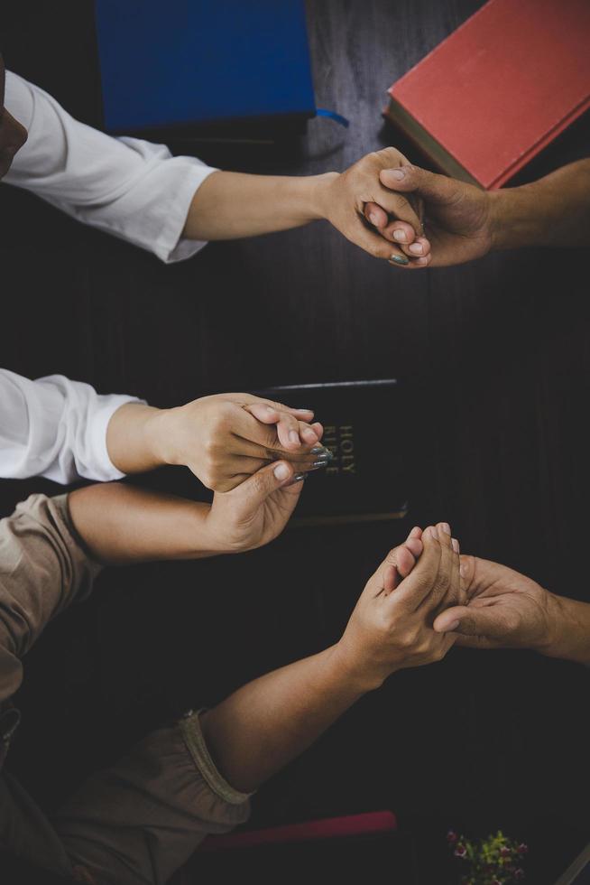 Group of people praying worship believe photo