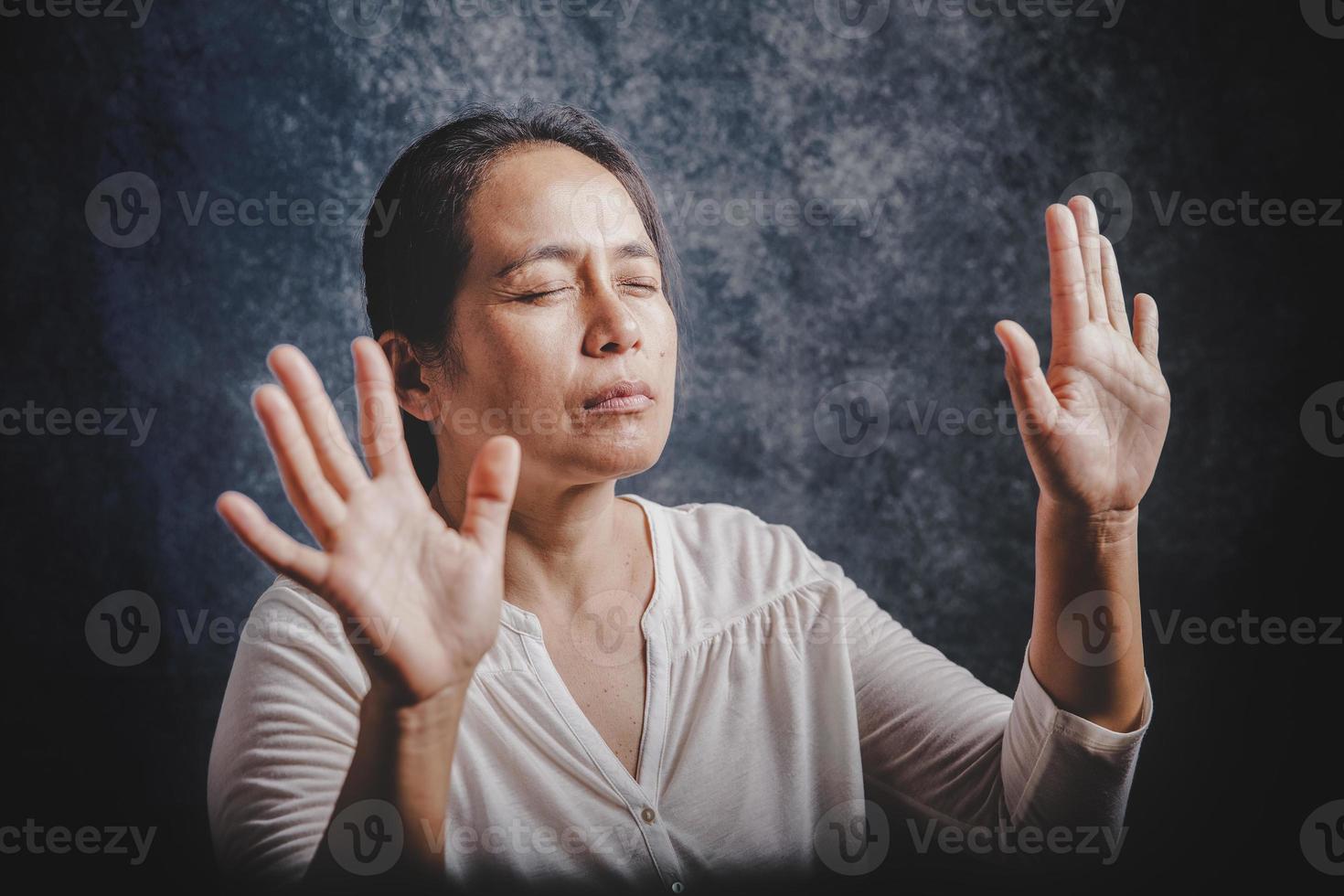 Woman Pray for god blessing to wishing have a better life photo