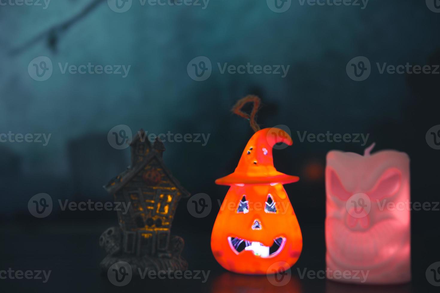 Spooky cemetery with glow halloween pumpkin photo