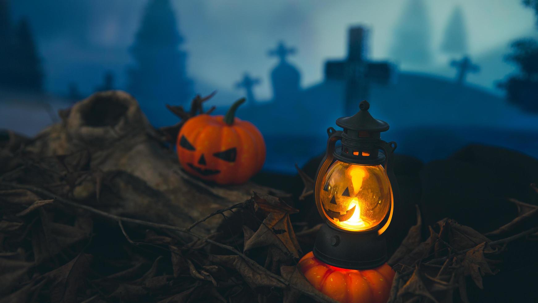 Spooky cemetery with glow halloween pumpkin photo