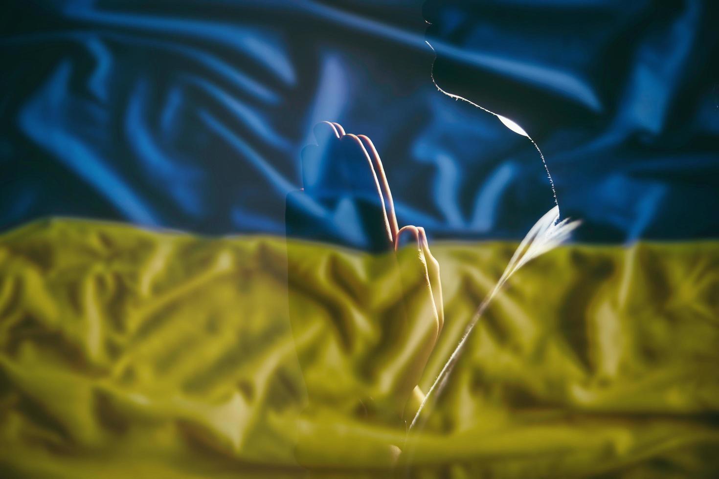 Pray for Ukraine, flag Ukraine. Russia vs Ukraine stop war. Pray Ukraine, eucharist therapy bless god helping, belief, forgiveness, freedom, hope and faith, christian religion concept photo