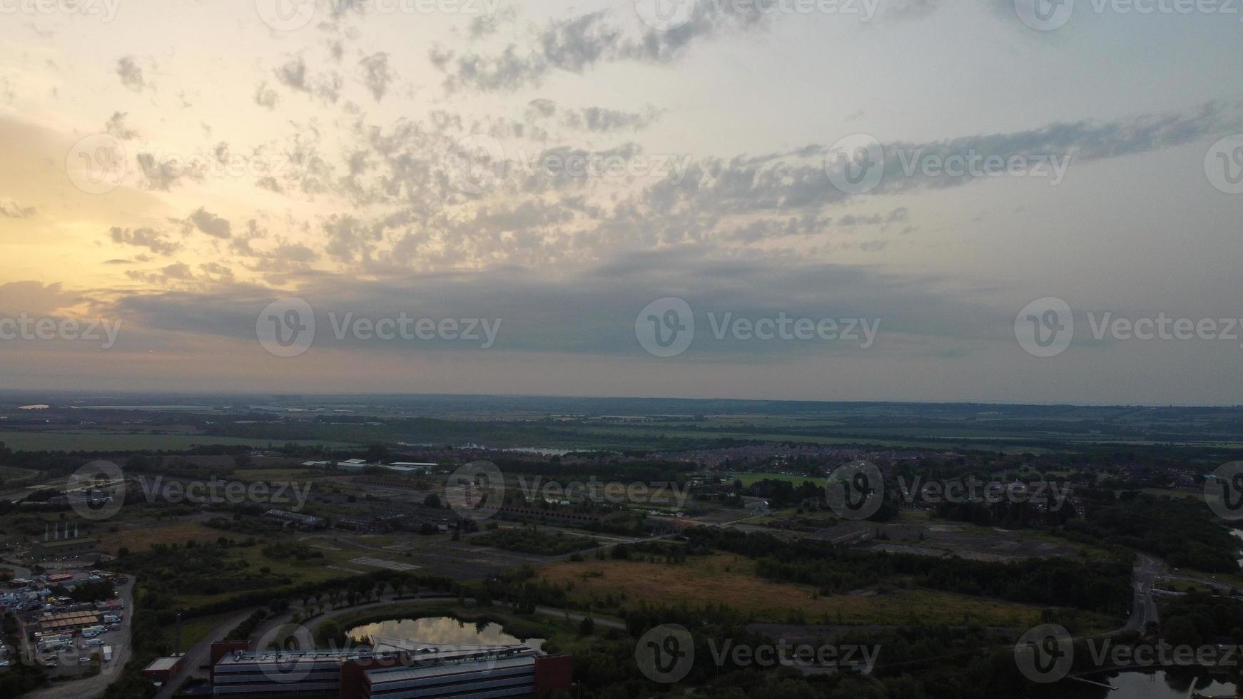 High Angle Aerial View footage over Windmill Wind Turbine at Stewartby Lake of England at Sunrise photo