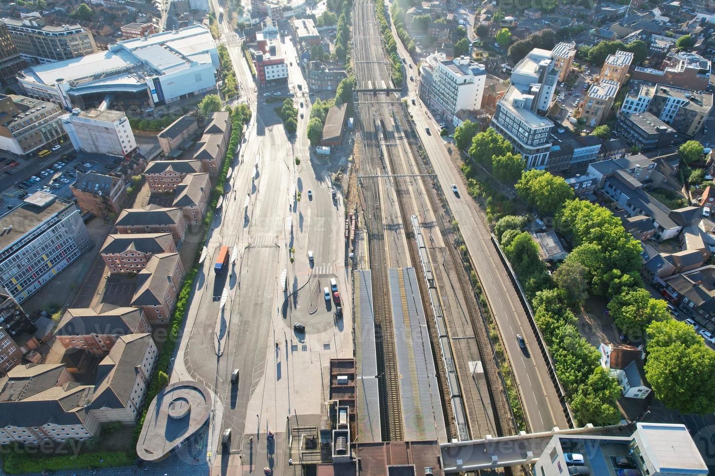High Angle Drone's View of Luton City Center and Railway Station, Luton England. Luton is town and borough with unitary authority status, in the ceremonial county of Bedfordshire photo