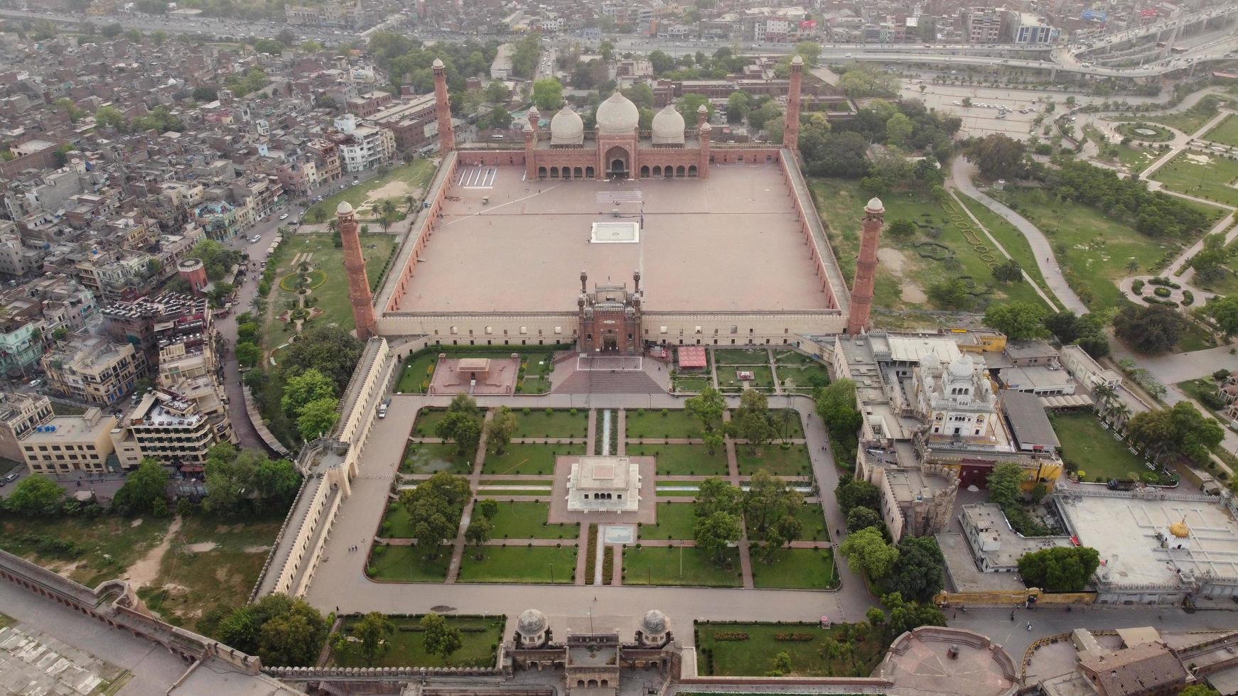 The Royal Mosque at Lahore Pakistan, Drone's High Angle View of Mughal era congregational mosque in Lahore, Punjab Pakistan photo