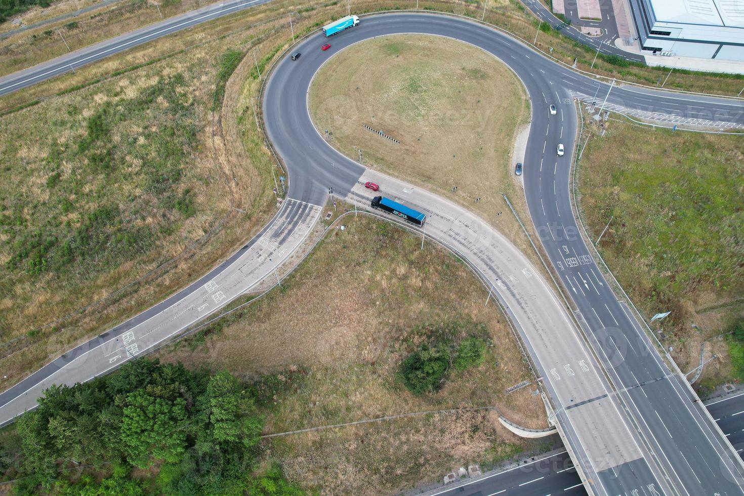Aerial View and High Angle Footage of British Motorways Interchange of M1 Junction 11a at North Luton City of England UK. photo
