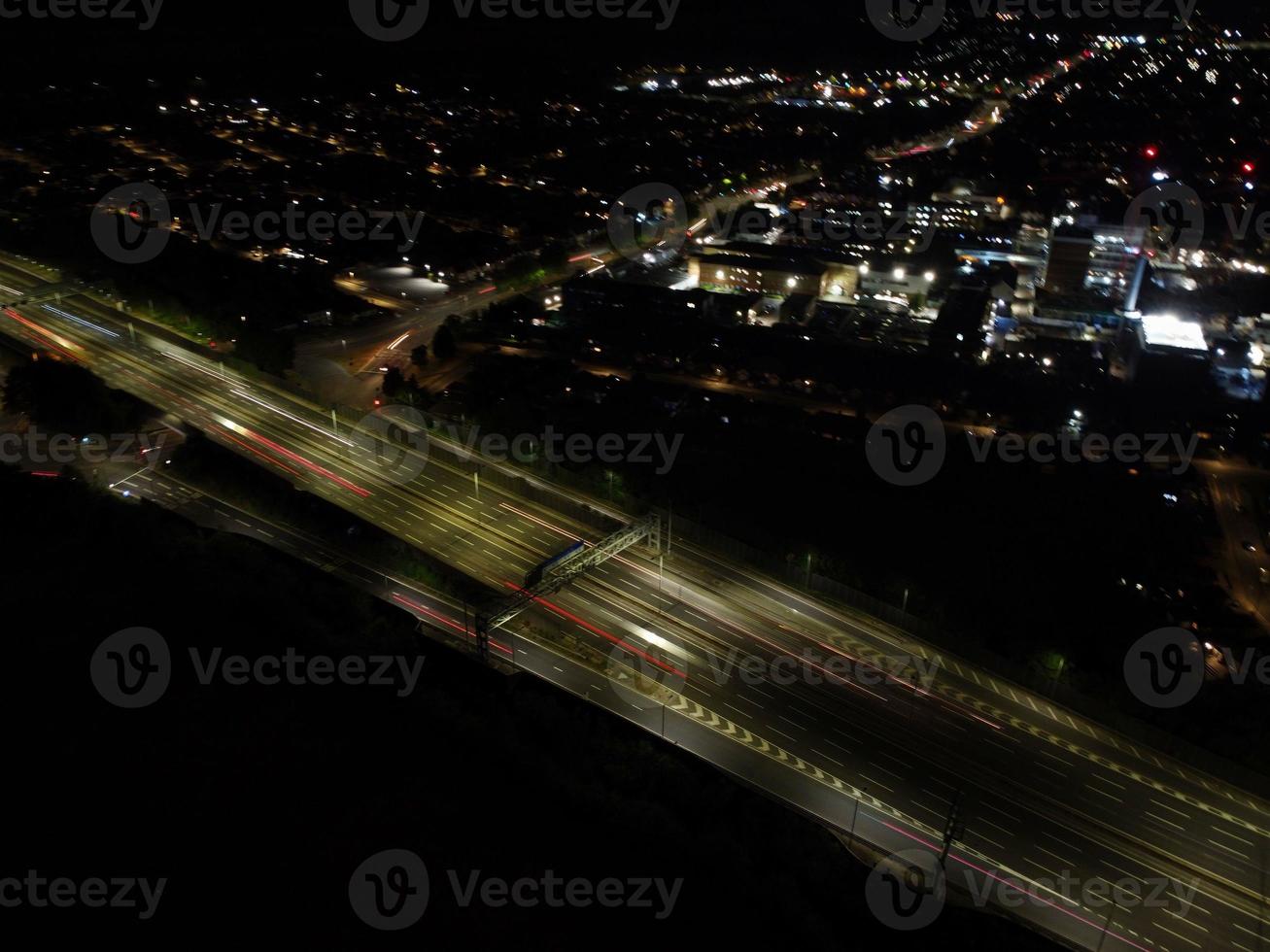 Beautiful Aerial High Angle View of British Motorways and Traffic at Luton Town of England UK at Night after Sunset photo