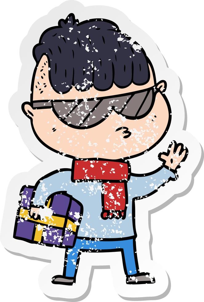 pegatina angustiada de un niño de dibujos animados con gafas de sol que lleva un regalo de Navidad vector