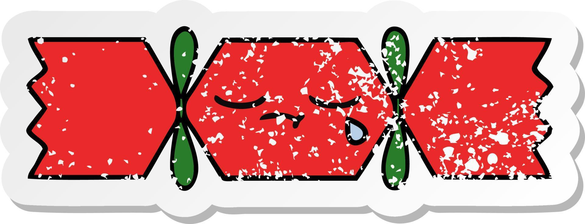 distressed sticker of a cute cartoon christmas cracker vector