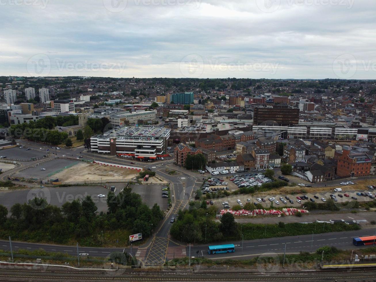 High Angle Footage of London Luton Town and Aerial view of Central Railway Station, Train Tracks of England UK photo