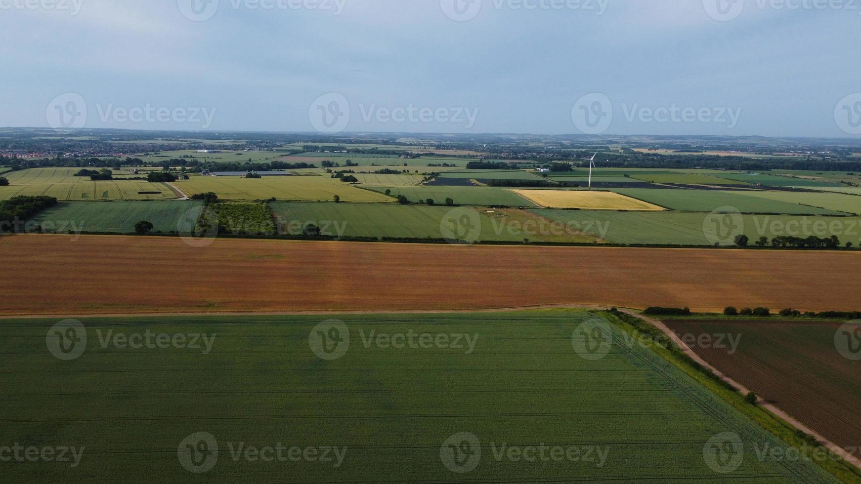 Aerial footage High Angle view of Green Energy natural Generators Sources of Wind turbines and solar panels Farms at England UK photo