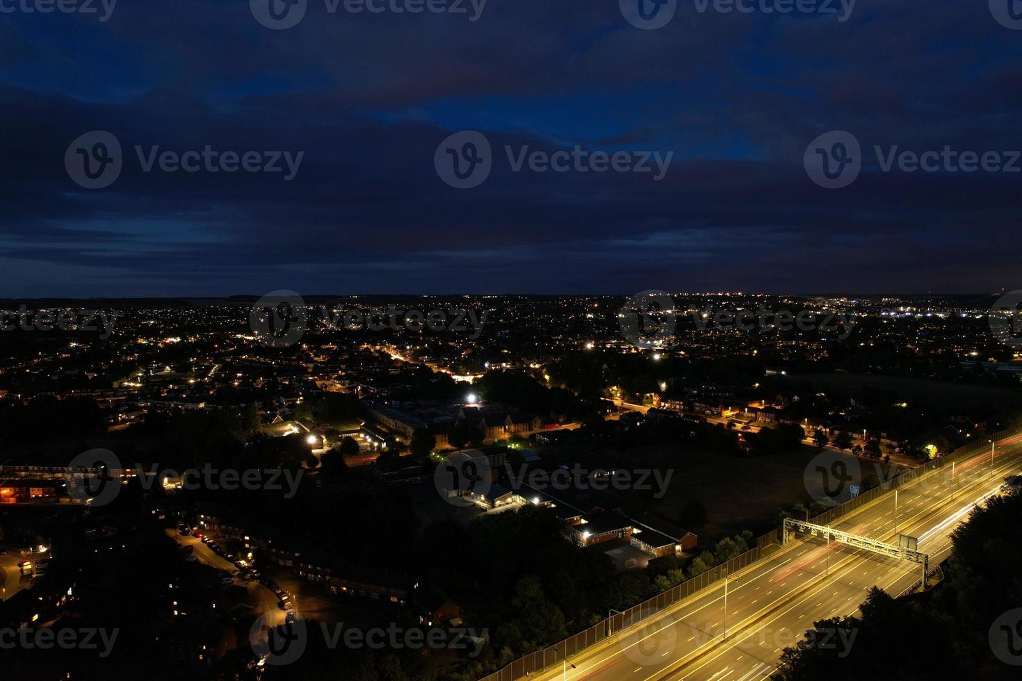 Beautiful Aerial High Angle View of British Motorways and Traffic at Luton Town of England UK at Night after Sunset photo