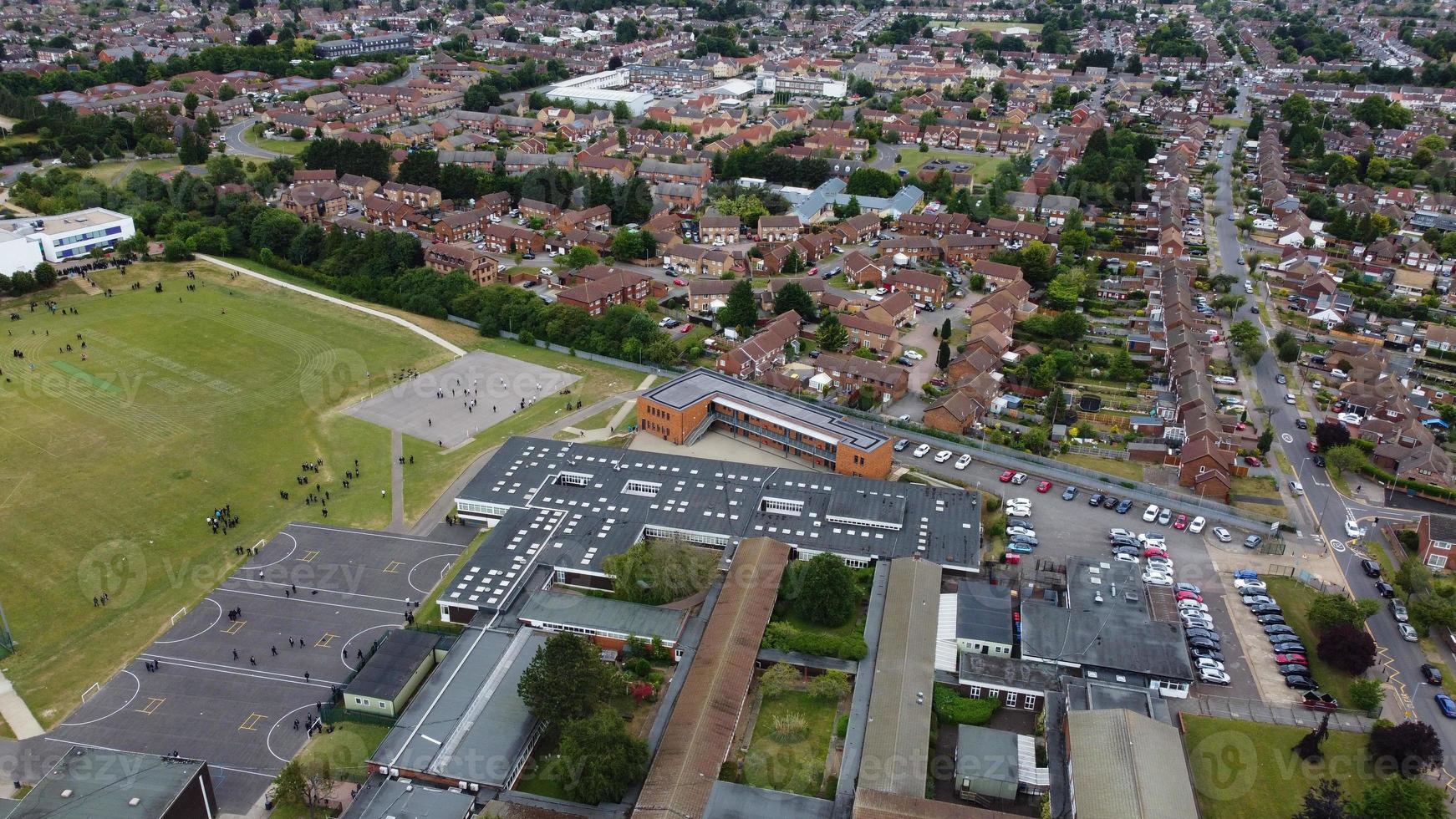 An Aerial Footage and High Angle view of Play Ground of a High School of boys at Luton Town of England, British Motorways and Highways photo