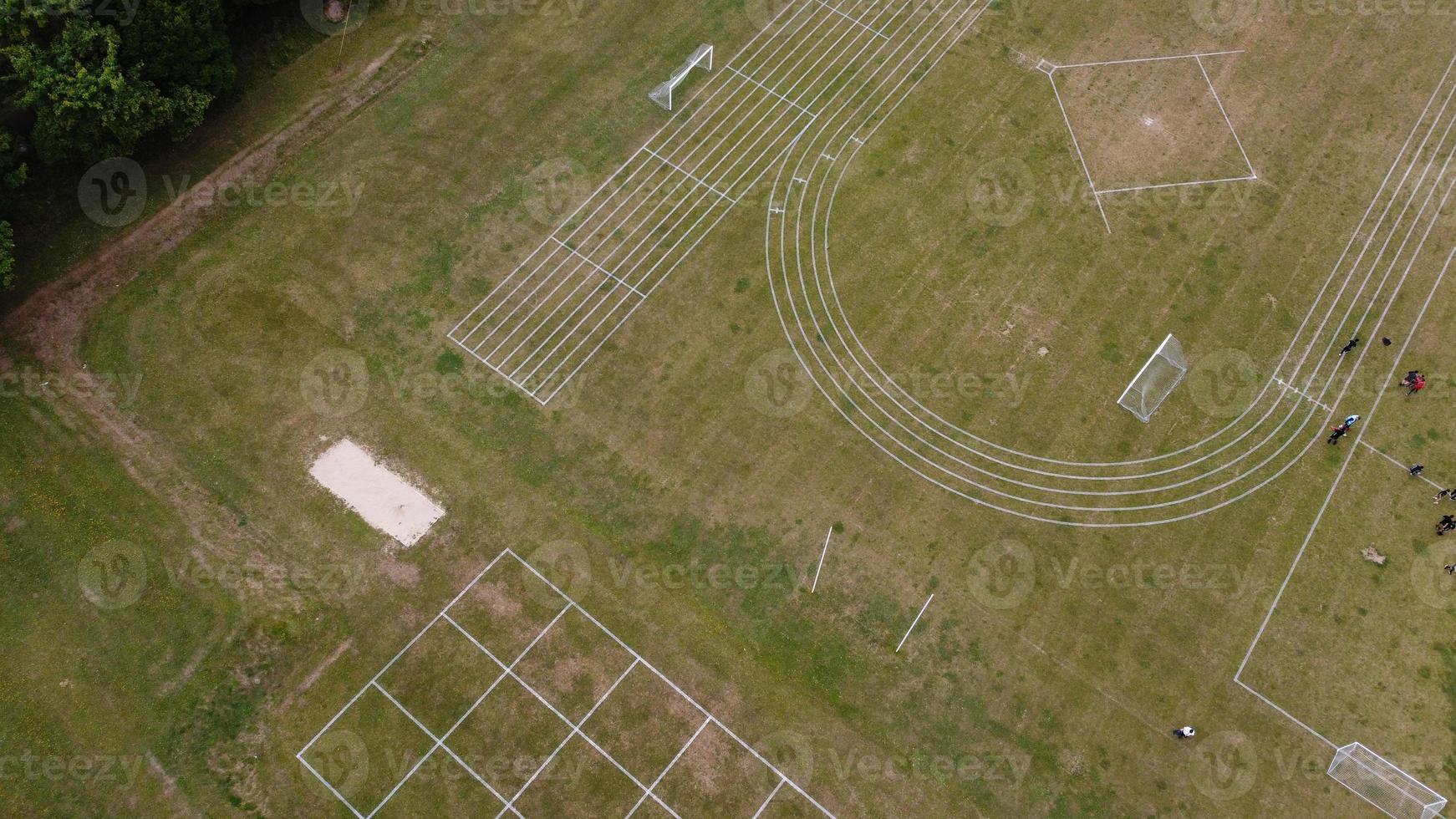 An Aerial Footage and High Angle view of Play Ground of a High School of boys at Luton Town of England, British Motorways and Highways photo