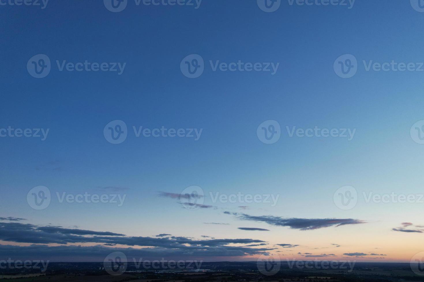 Gorgeous Aerial View of Luton City of England UK at Sunset Time, Colourful Clouds high angle footage taken by drone photo