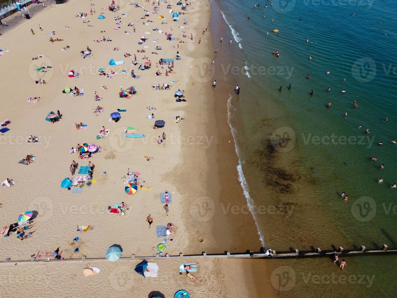 High Angle Sea View Beach Front with People at Bournemouth City of England UK, Aerial Footage of British Ocean photo