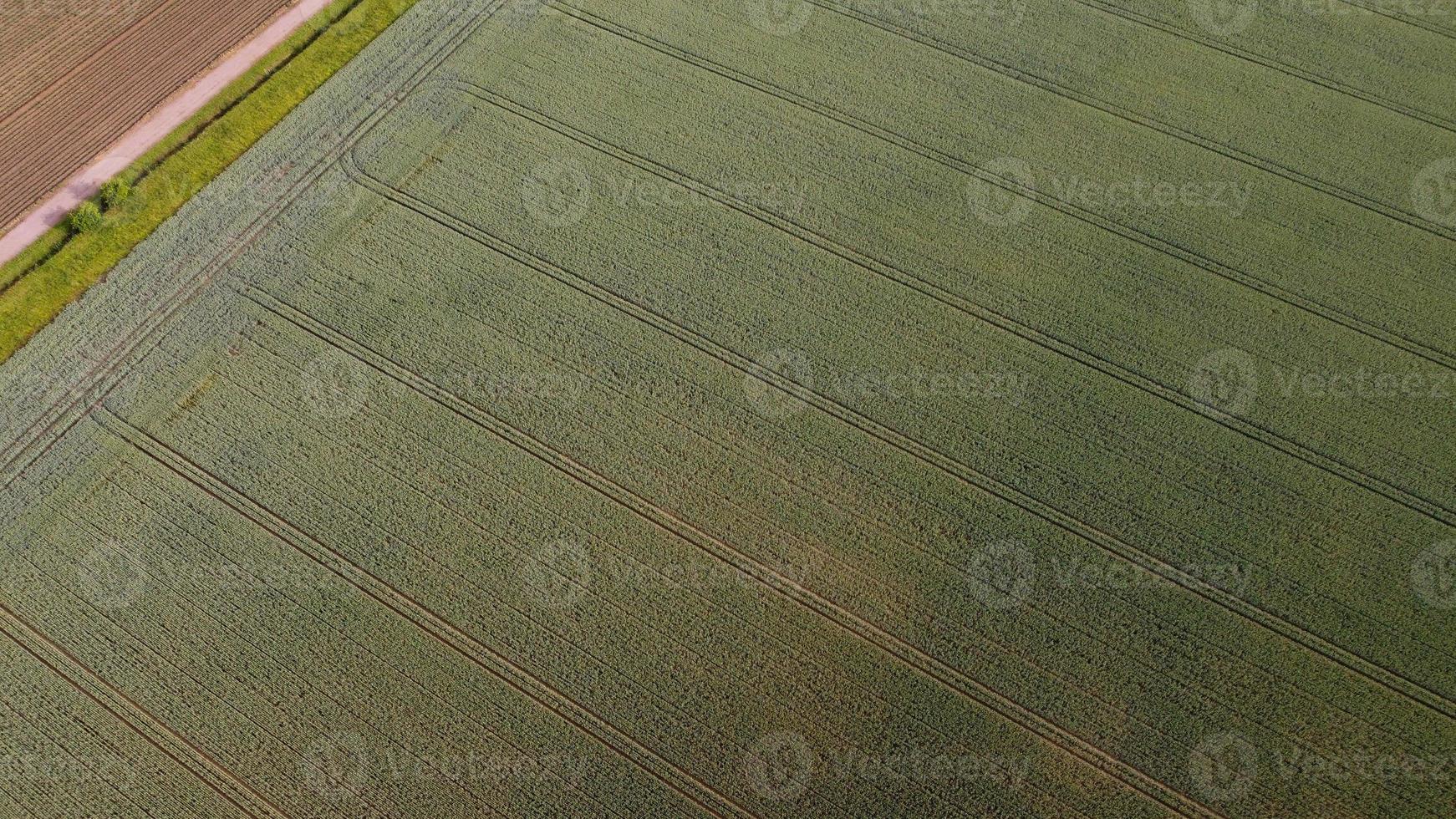 Aerial footage High Angle view of Green Energy natural Generators Sources of Wind turbines and solar panels Farms at England UK photo