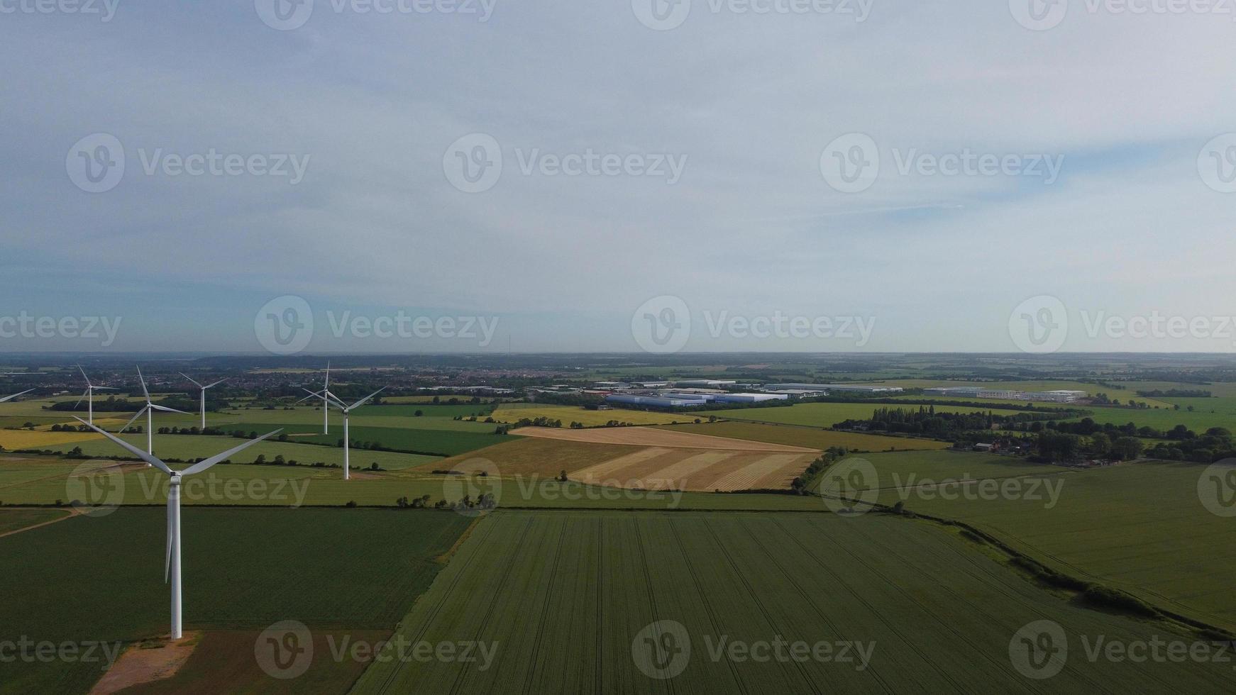Aerial footage High Angle view of Green Energy natural Generators Sources of Wind turbines and solar panels Farms at England UK photo