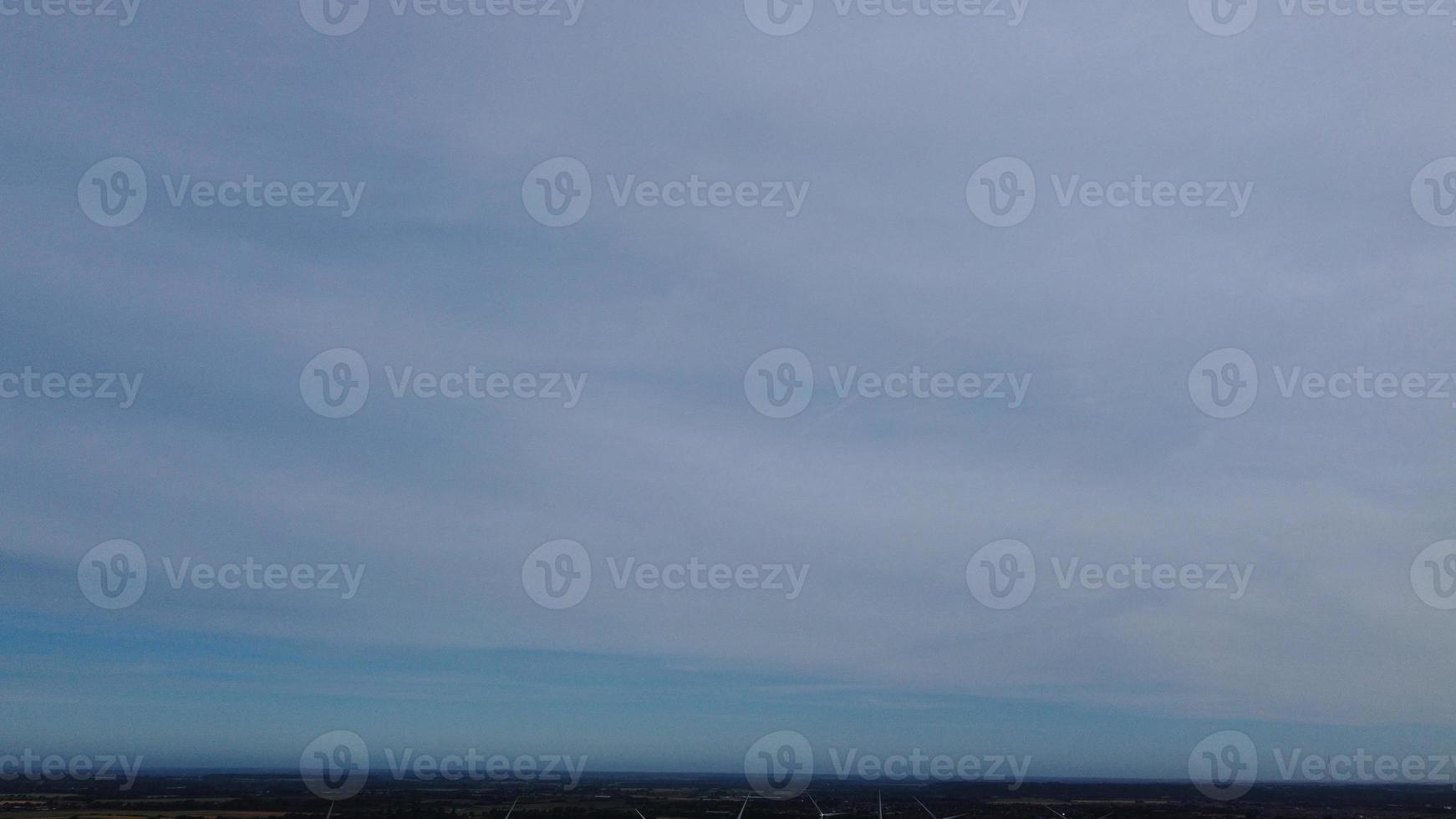 Aerial footage High Angle view of Green Energy natural Generators Sources of Wind turbines and solar panels Farms at England UK photo