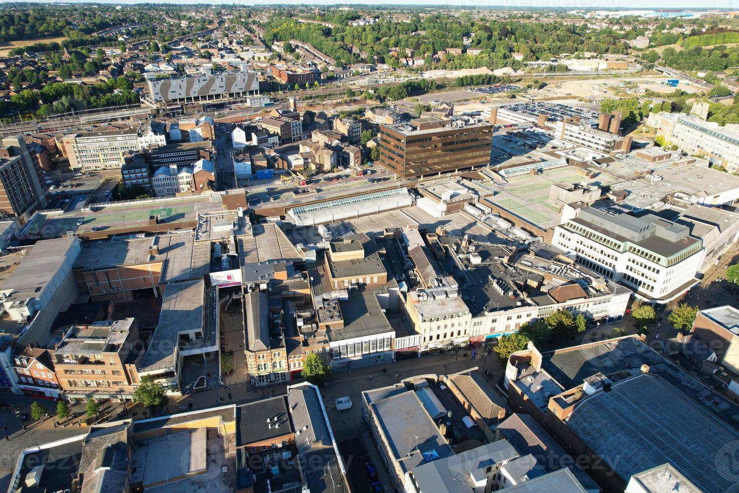 High Angle Drone's View of Luton City Center and Railway Station, Luton England. Luton is town and borough with unitary authority status, in the ceremonial county of Bedfordshire photo