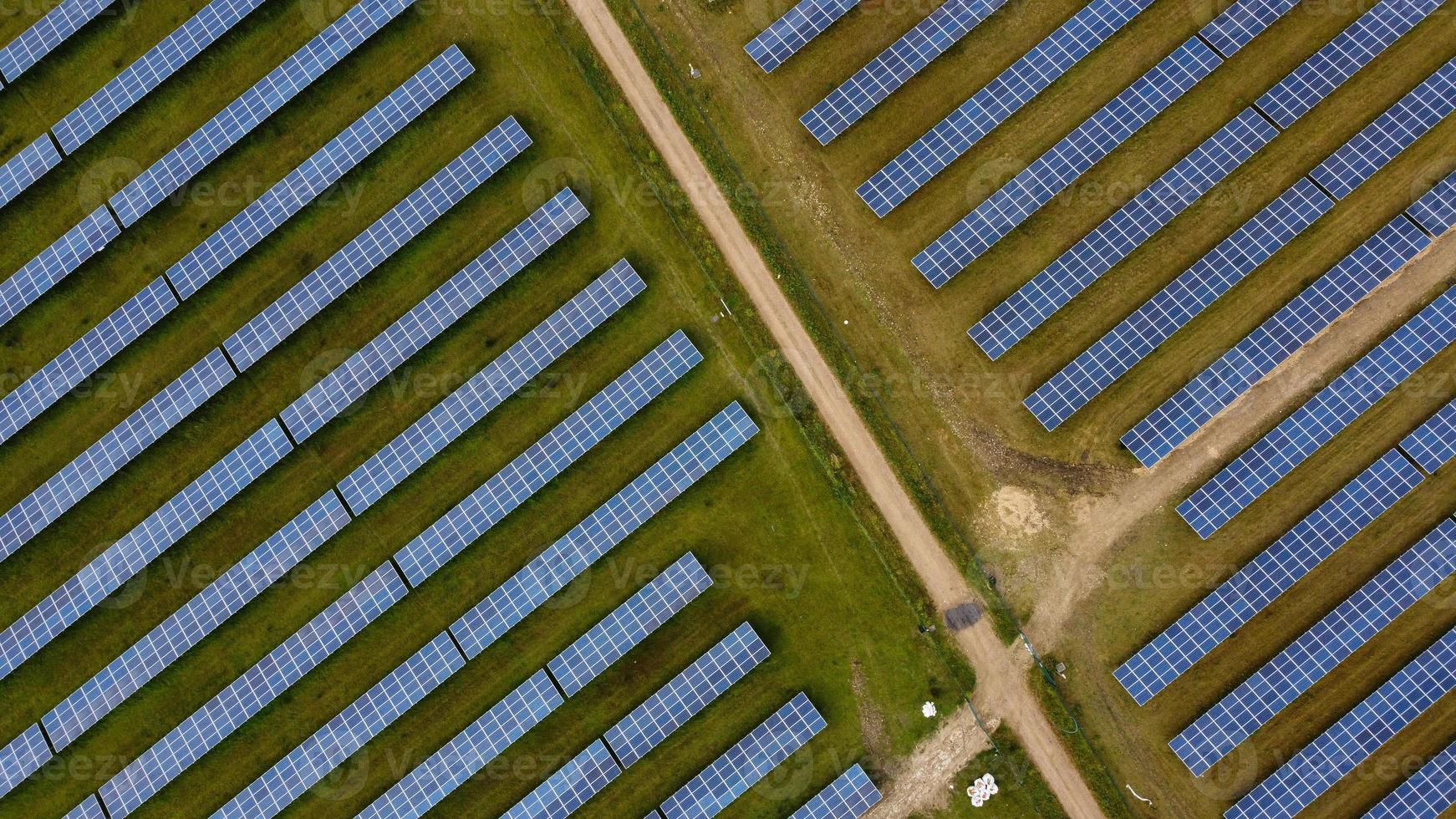 Aerial footage High Angle view of Green Energy natural Generators Sources of Wind turbines and solar panels Farms at England UK photo