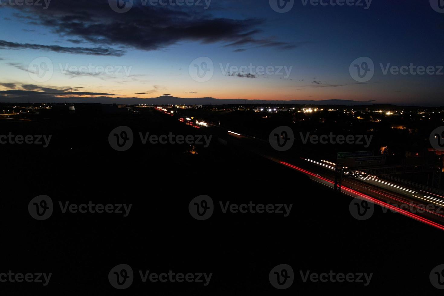 Beautiful Aerial High Angle View of British Motorways and Traffic at Luton Town of England UK at Night after Sunset photo