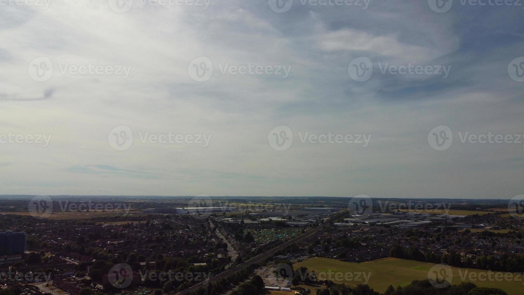 Aerial view of Luton Town with High Angle Footage of Train and Track Passing through city of England UK photo