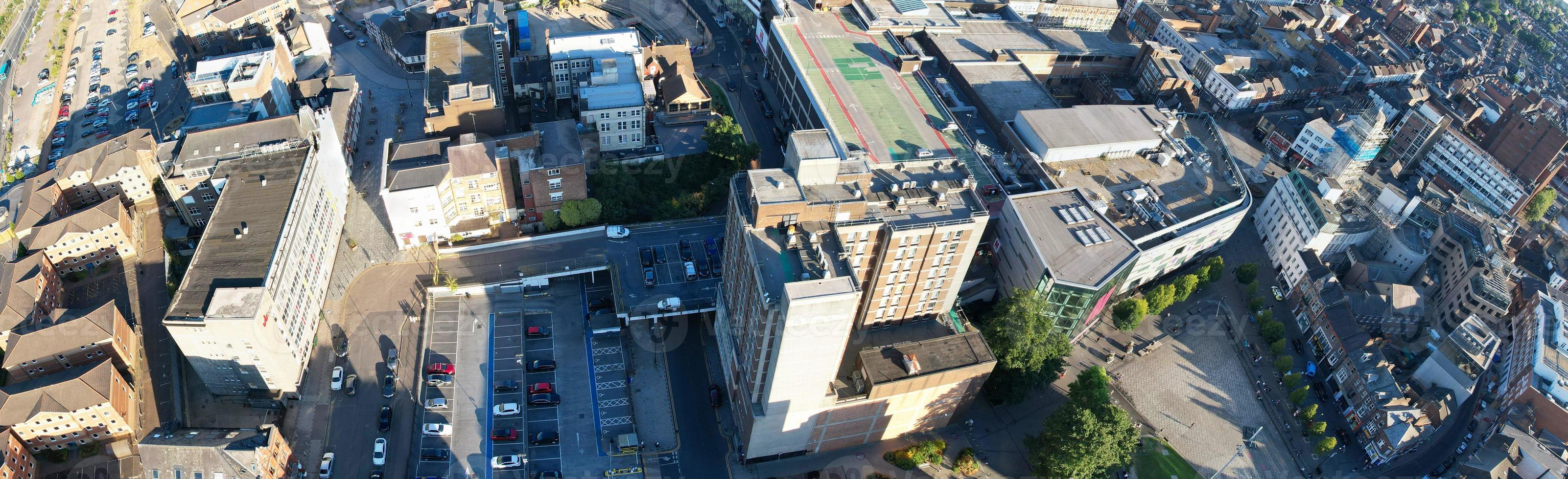 High Angle Drone's View of Luton City Center and Railway Station, Luton England. Luton is town and borough with unitary authority status, in the ceremonial county of Bedfordshire photo