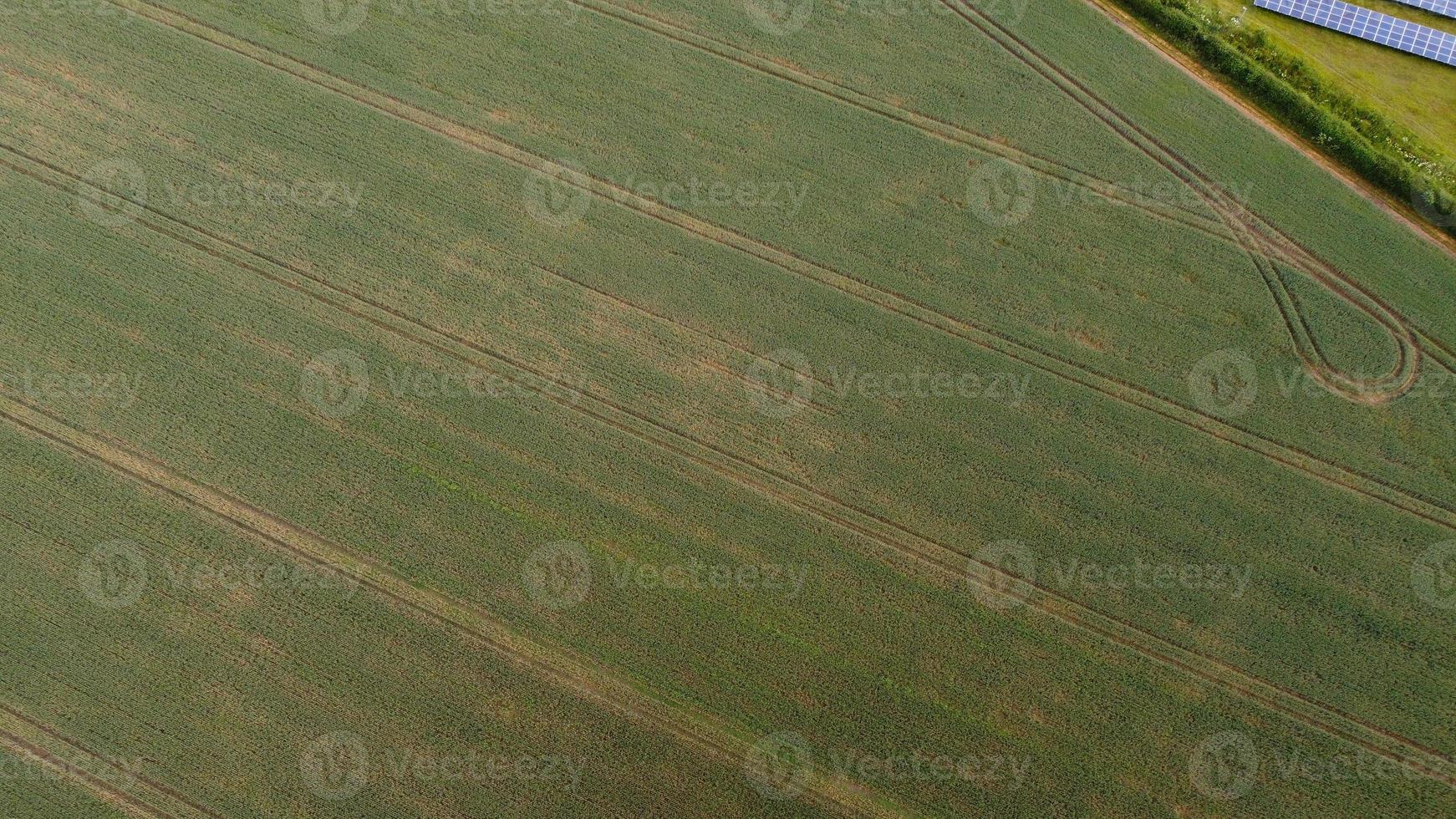Aerial footage High Angle view of Green Energy natural Generators Sources of Wind turbines and solar panels Farms at England UK photo