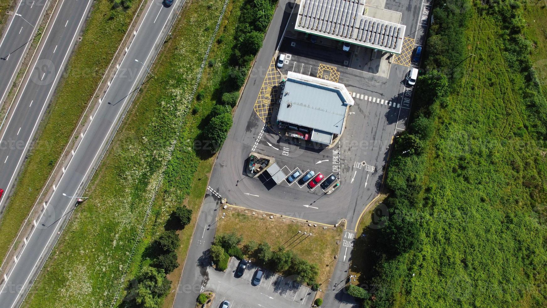 High Angle aerial view of British Roads and Traffic Passing through countryside of England UK photo