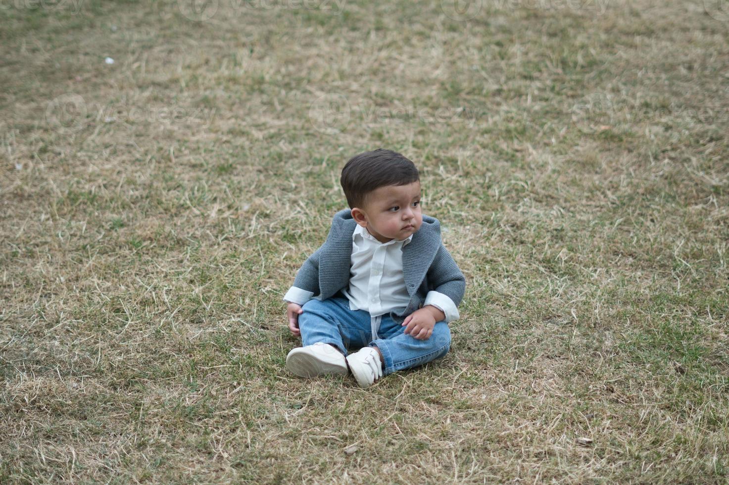 Cute Little Infant Baby is Posing at a Local Public Park of Luton Town of England UK photo