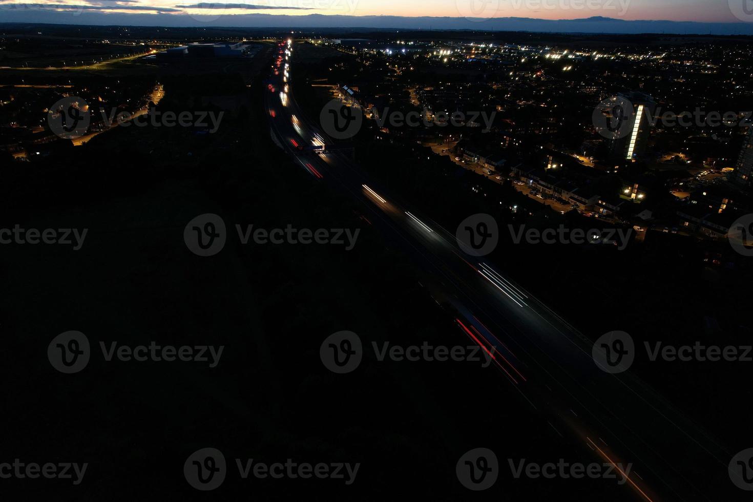 Beautiful Aerial High Angle View of British Motorways and Traffic at Luton Town of England UK at Night after Sunset photo