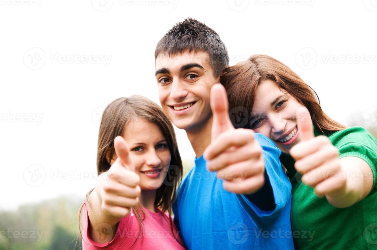 Happy friends giving okey sign photo