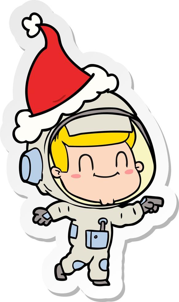 happy sticker cartoon of a astronaut man wearing santa hat vector