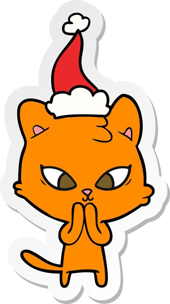 cute sticker cartoon of a cat wearing santa hat vector