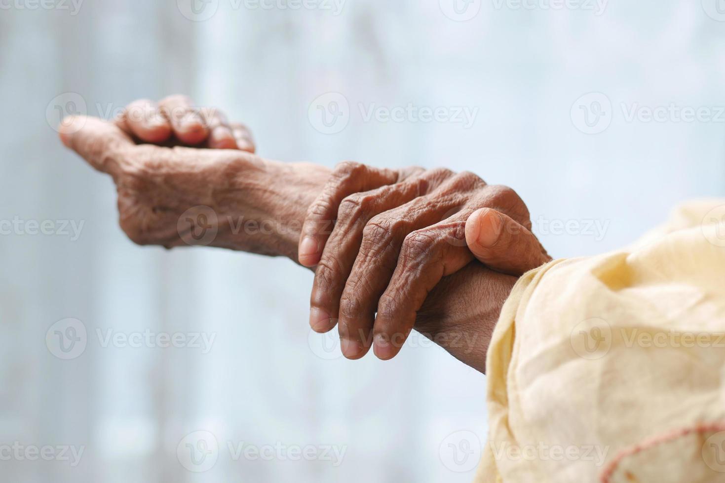 Elderly woman suffering from pain isolated on white photo