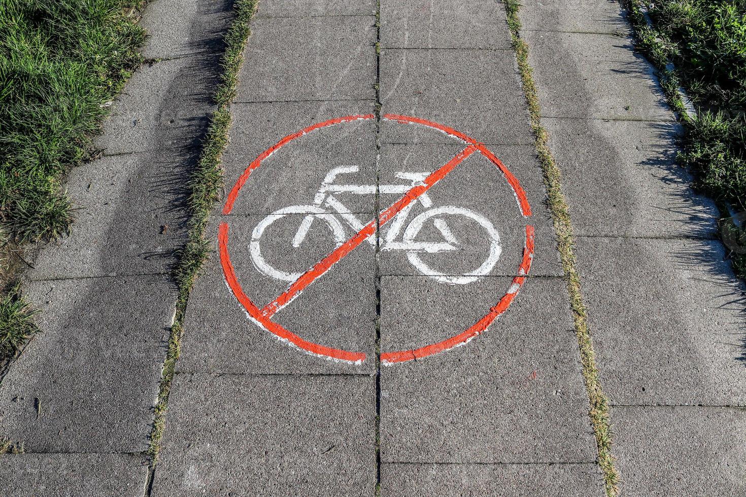 Painted bicycle signs on asphalt found in the city streets of Germany. photo