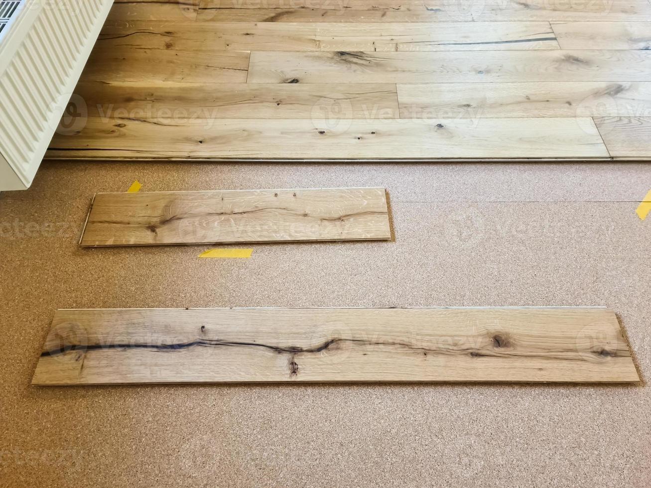 A parquet floor made of wood while it is being freshly installed. photo