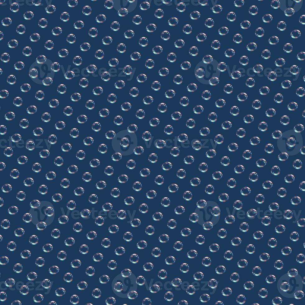 Seamless pattern of soap bubbles isolated on a blue background. photo