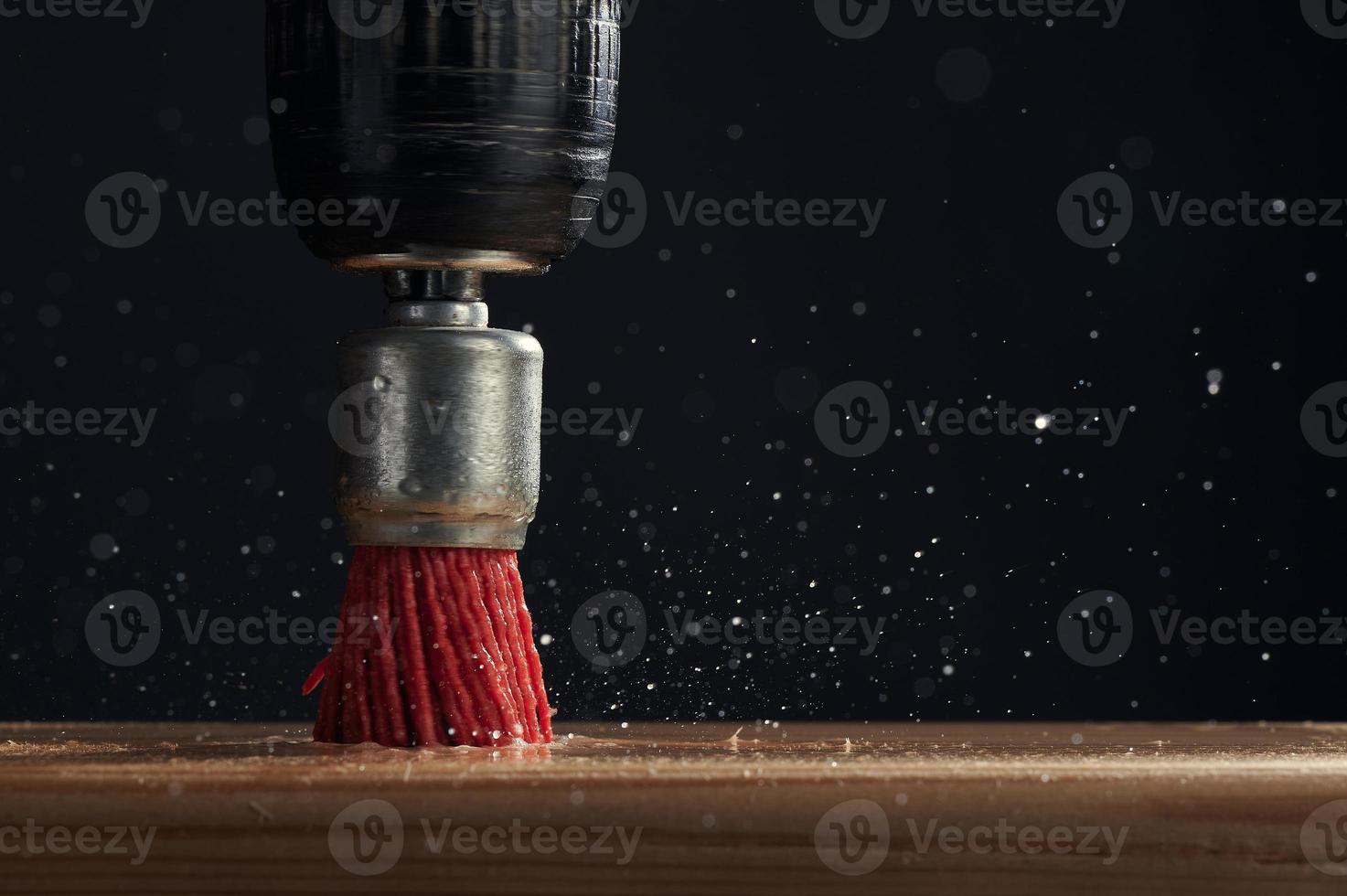 Soft brush on the drill close-up. Cleaning the surface with an electric tool. Photo with copy space.